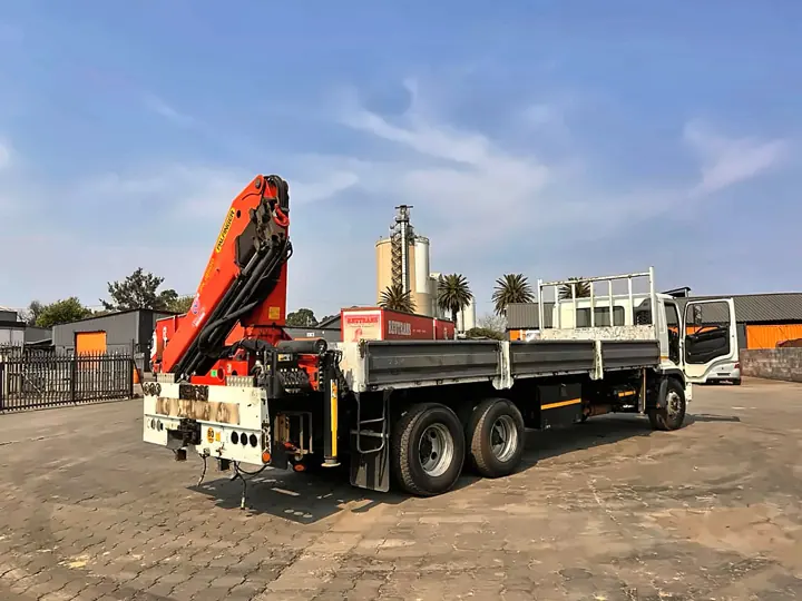 Crane truck before refurbishment, with a worn grey body