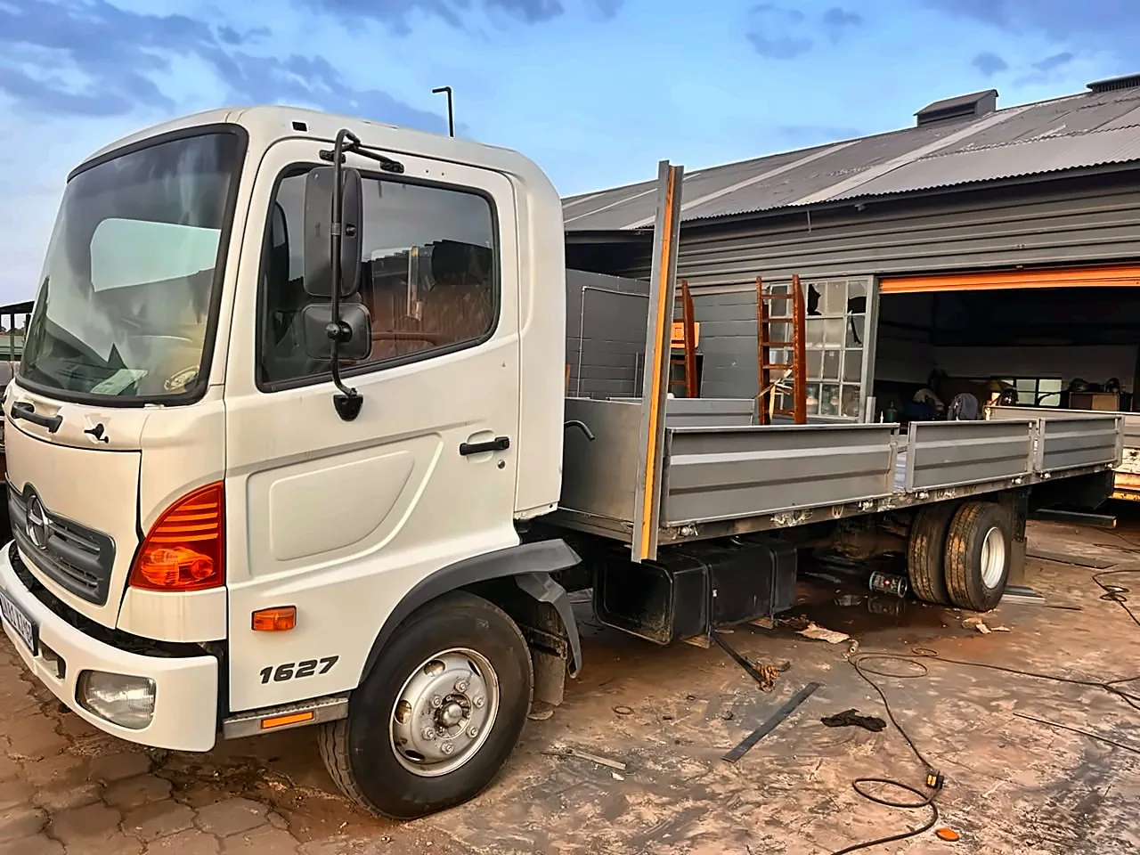 Hino 1627 truck with a new steel dropside body being fitted