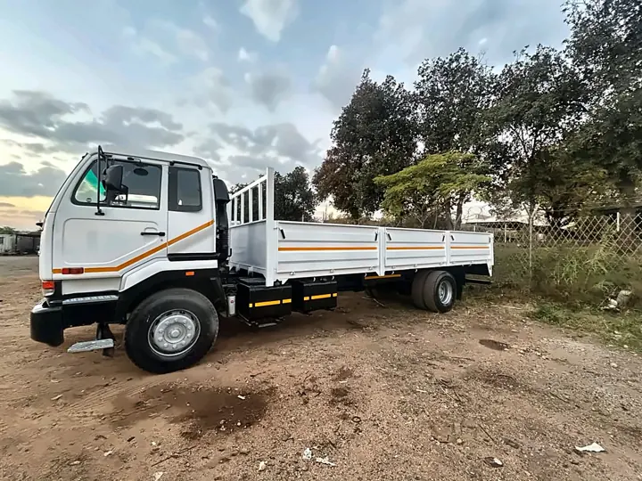 Finished white dropside truck with orange striping